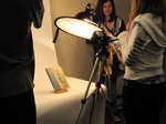 Students adjust lighting before photographing an artifact from the Scarborough Historical Society collection.